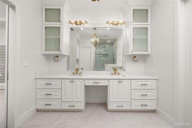 1313 Oriole Ave, Mcallen, TX 78504 - full bathroom with baseboards, a sink, and marble finish floor