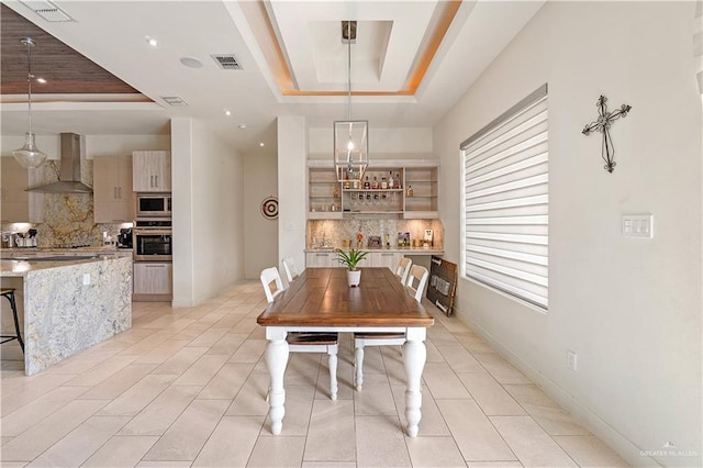 2520 Colvin Ave, Edinburg, TX 78539 - dining area with a tray ceiling and a wealth of natural light