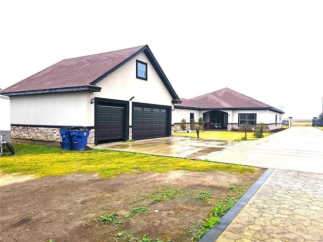 view of side of property with a garage