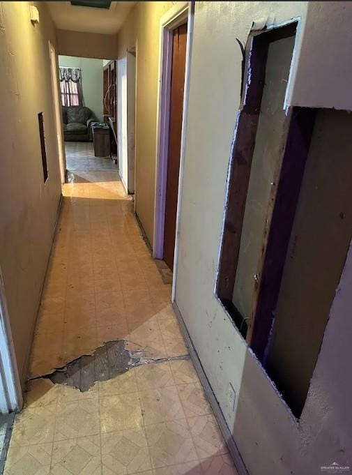hallway featuring light floors