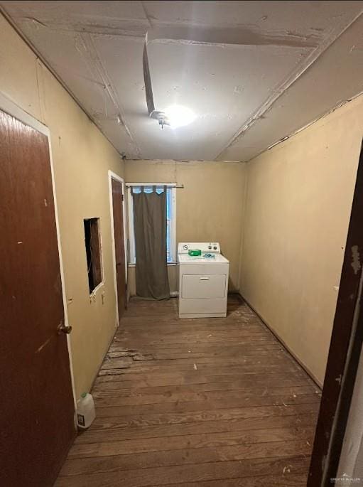 interior space featuring wood finished floors and washer / clothes dryer
