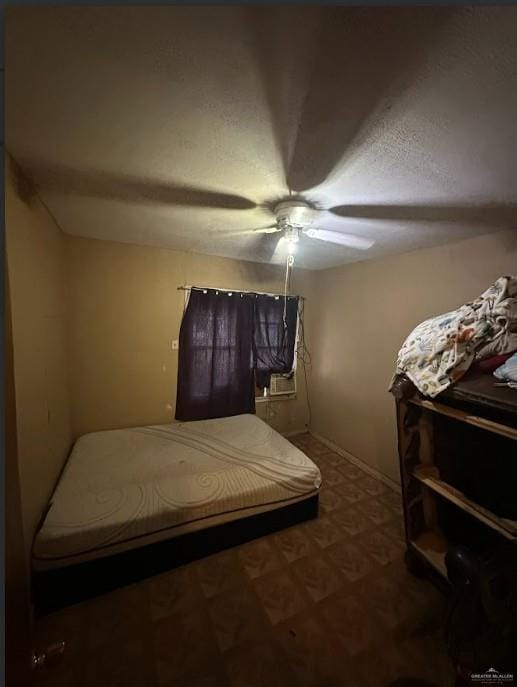 bedroom featuring tile patterned floors and ceiling fan