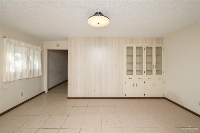 2805 N Blake St, Harlingen, TX 78550 - spare room with a textured ceiling and baseboards