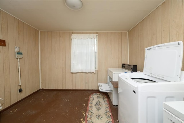 2805 N Blake St, Harlingen, TX 78550 - washroom featuring washer and clothes dryer and wood walls