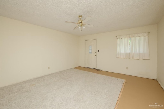 2805 N Blake St, Harlingen, TX 78550 - empty room with light carpet, a ceiling fan, and a textured ceiling