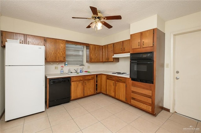 2805 N Blake St, Harlingen, TX 78550 - kitchen with black appliances, brown cabinets, light countertops, ceiling fan, and a textured ceiling