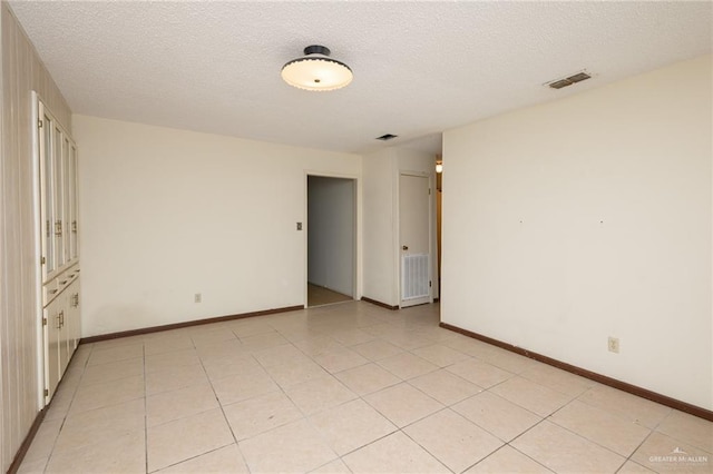 2805 N Blake St, Harlingen, TX 78550 - empty room featuring a textured ceiling and baseboards