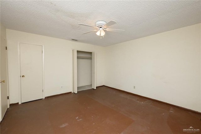 2805 N Blake St, Harlingen, TX 78550 - unfurnished bedroom with concrete floors, a ceiling fan, and a textured ceiling