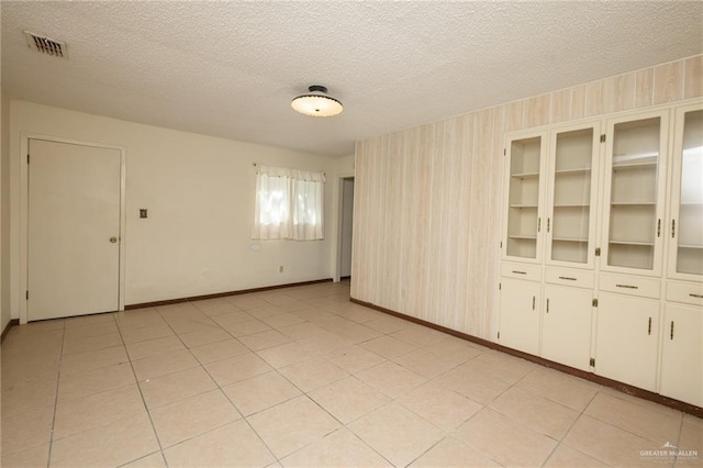 2805 N Blake St, Harlingen, TX 78550 - empty room featuring a textured ceiling and baseboards