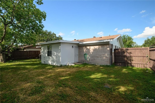 2805 N Blake St, Harlingen, TX 78550 - back of house with brick siding and a fenced backyard