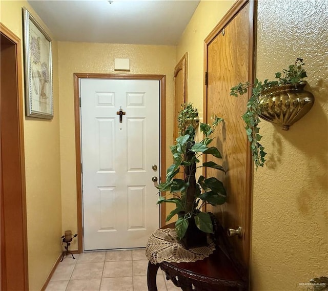 2312 Yarrow St, Mission, TX 78574 - entryway with light tile patterned floors and a textured wall