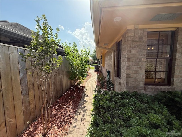 2312 Yarrow St, Mission, TX 78574 - view of side of property featuring stone siding