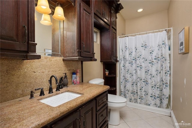 full bathroom with tile patterned flooring, vanity, tasteful backsplash, and toilet