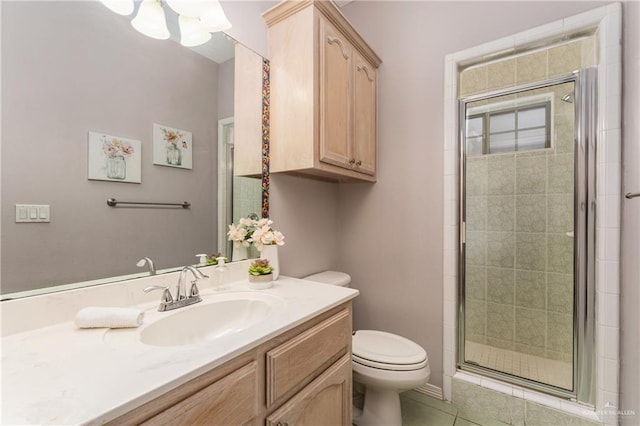 bathroom with toilet, vanity, tile patterned floors, and a shower with door