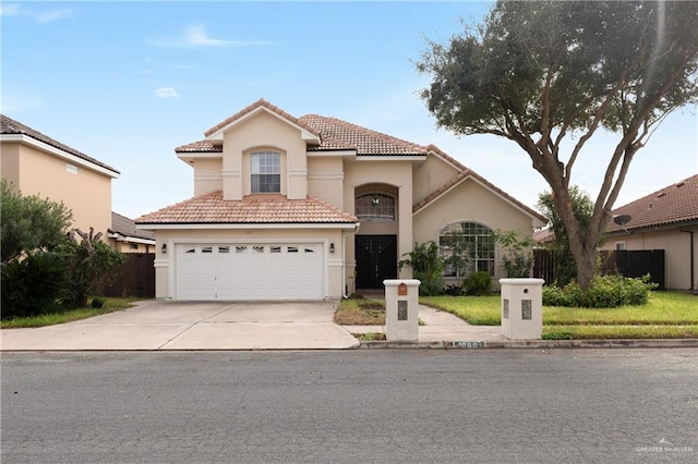 mediterranean / spanish-style house with a garage