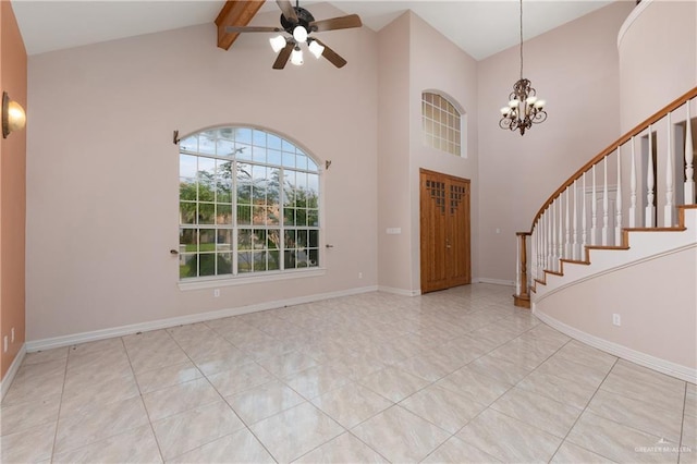 entrance foyer featuring ceiling fan with notable chandelier and lofted ceiling with beams