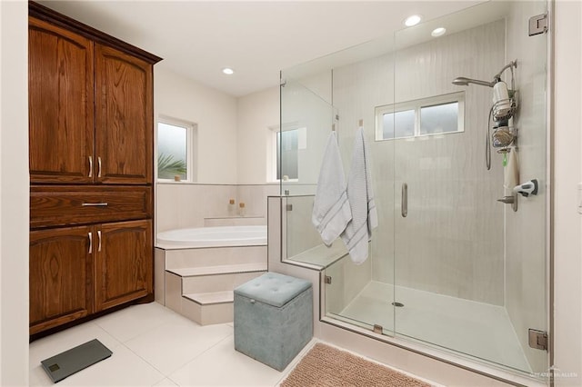 bathroom featuring plus walk in shower and tile patterned floors