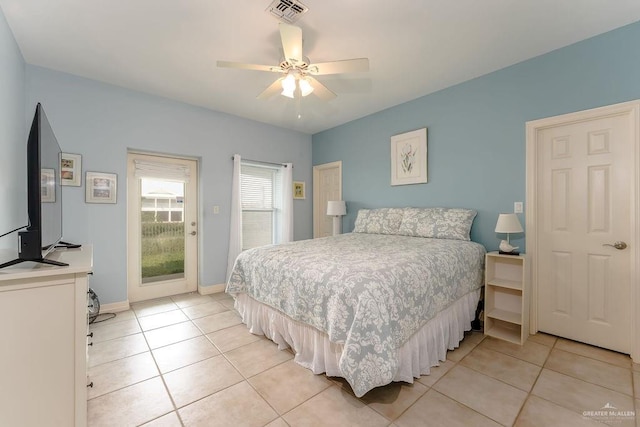 tiled bedroom featuring ceiling fan