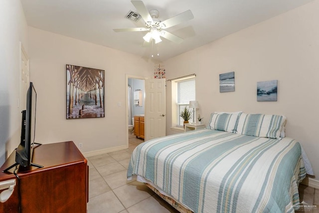 tiled bedroom with ceiling fan and connected bathroom