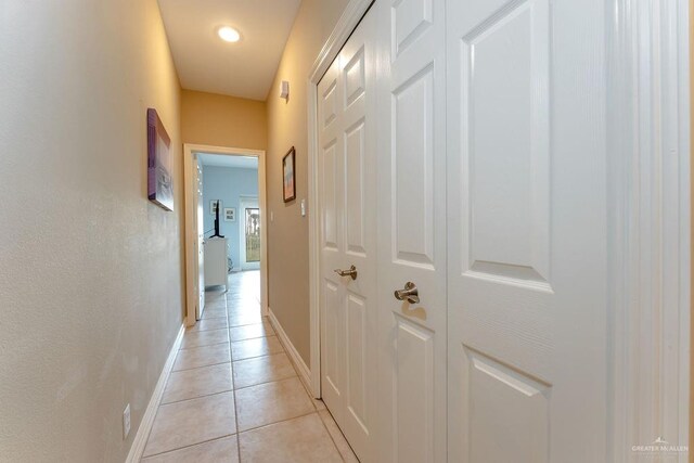 hall with light tile patterned flooring