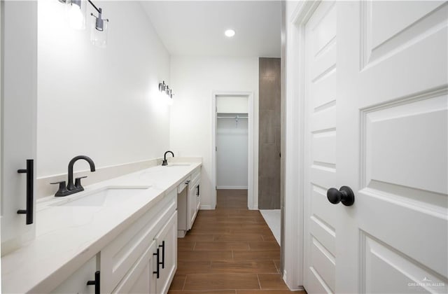 bathroom featuring hardwood / wood-style floors and vanity