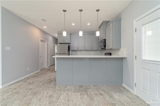 207 W Campeche Ave, Alton, TX 78573 - kitchen featuring appliances with stainless steel finishes, gray cabinets, a peninsula, light countertops, and baseboards