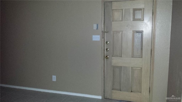 interior space with dark tile patterned floors