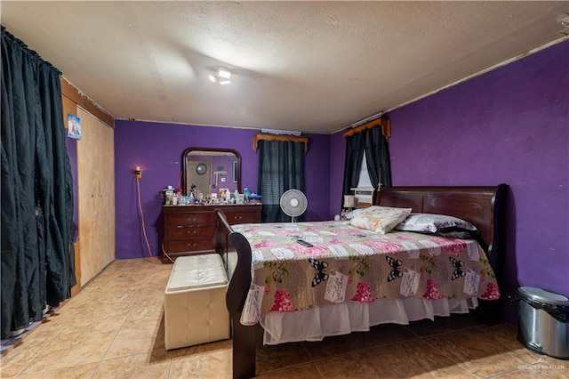 21707 Hidalgo St, Edcouch, TX 78538 - tiled bedroom with a textured ceiling