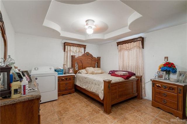 21707 Hidalgo St, Edcouch, TX 78538 - bedroom with washer / clothes dryer, a raised ceiling, light tile patterned floors, and a ceiling fan
