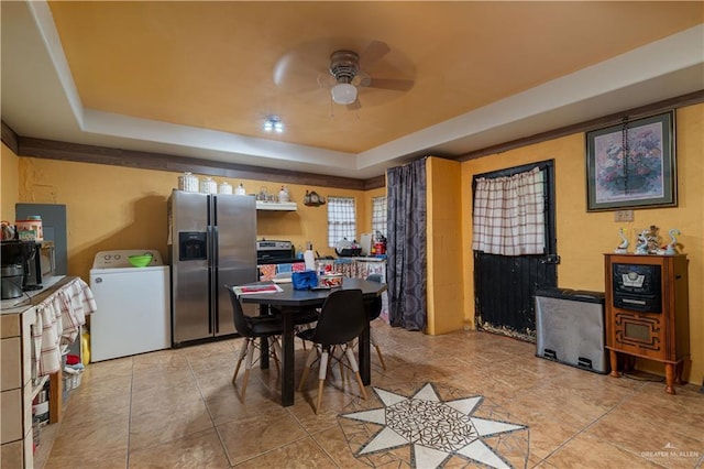 21707 Hidalgo St, Edcouch, TX 78538 - dining space featuring washer / dryer, a raised ceiling, and a ceiling fan