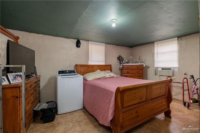 21707 Hidalgo St, Edcouch, TX 78538 - bedroom featuring washer / clothes dryer, tile patterned flooring, and cooling unit
