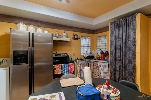 21707 Hidalgo St, Edcouch, TX 78538 - kitchen with stainless steel appliances, under cabinet range hood, and washer / dryer