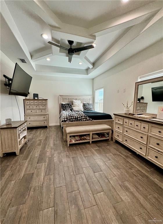 bedroom featuring beamed ceiling, dark hardwood / wood-style floors, and ceiling fan