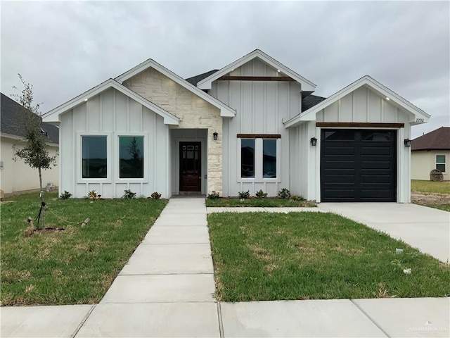 modern inspired farmhouse with a garage and a front yard