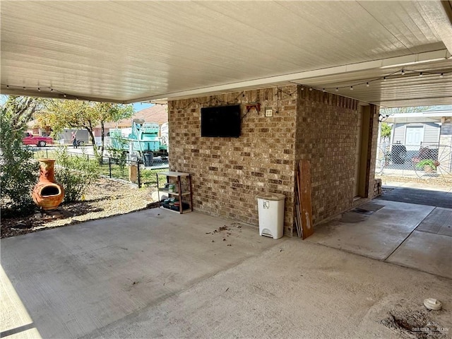 view of patio featuring fence