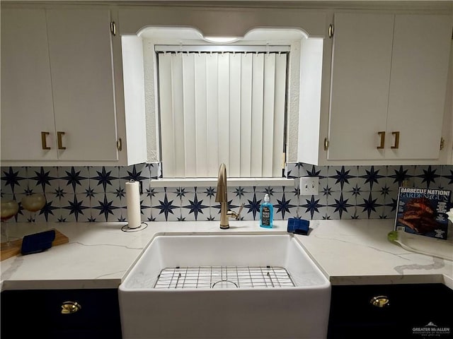 kitchen with tasteful backsplash and a sink