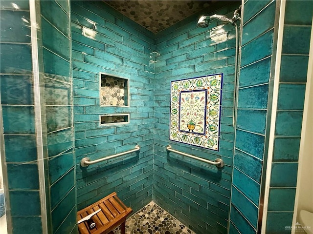 full bathroom with tiled shower