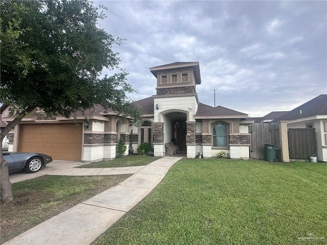 2308 Monte Grande Dr, San Juan, TX 78589 - view of front of home featuring stone siding, driveway, and an attached garage