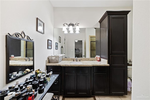 bathroom with vanity and tile patterned floors