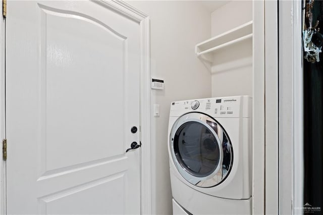 washroom with washer / dryer