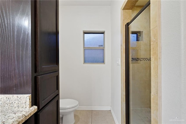 bathroom featuring an enclosed shower, vanity, tile patterned flooring, and toilet