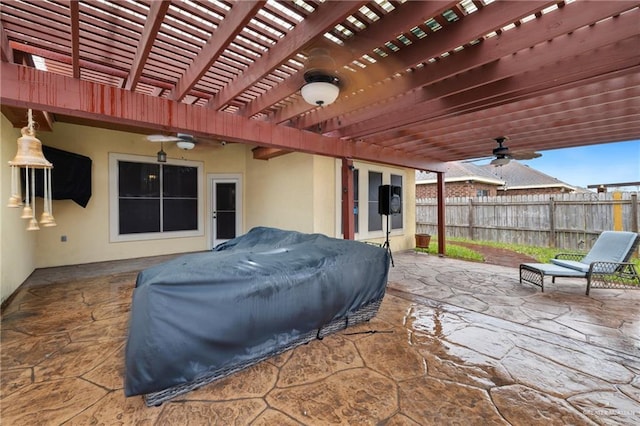 view of patio / terrace featuring ceiling fan and a pergola