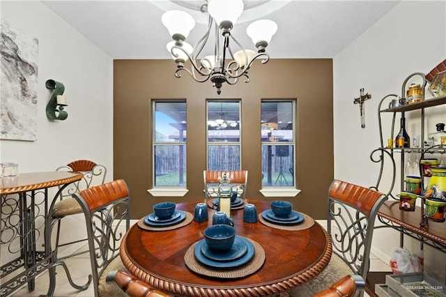 dining area featuring a notable chandelier