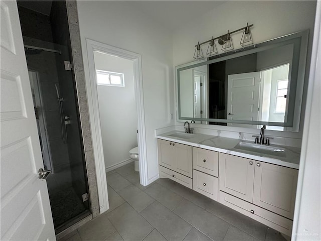 408 Janet Cir N, La Feria, TX 78559 - full bath with double vanity, a shower stall, and tile patterned flooring