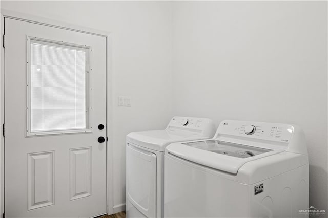 clothes washing area featuring washing machine and dryer