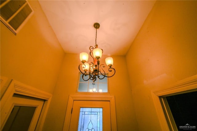 interior details featuring a notable chandelier