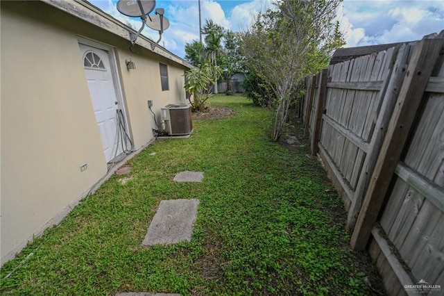 view of yard with central AC unit