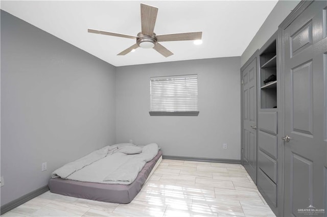7610 N Ware Rd, Mcallen, TX 78504 - bedroom with baseboards and a ceiling fan
