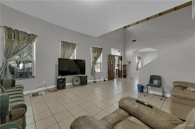 tiled living room with plenty of natural light