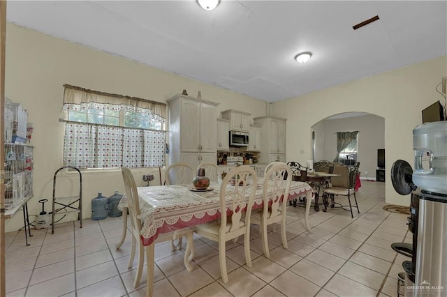 dining area with light tile patterned floors